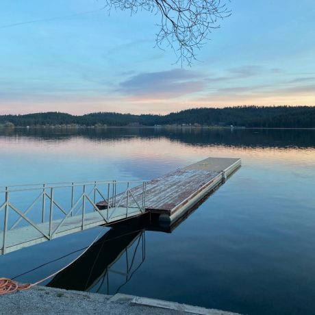 Scenic waterfront view at capturing serene mountain landscapes at Waitts Lake RV Resort and Cabins in Valley, WA.