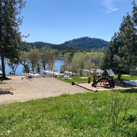 Scenic waterfront view at capturing serene mountain landscapes at Waitts Lake RV Resort and Cabins in Valley, WA.