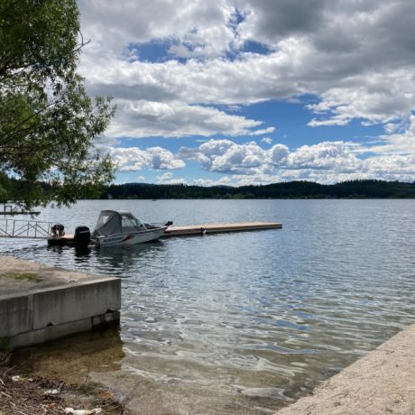 Scenic waterfront view at capturing serene mountain landscapes at Waitts Lake RV Resort and Cabins in Valley, WA.