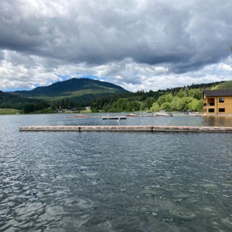 Scenic waterfront view at capturing serene mountain landscapes at Waitts Lake RV Resort and Cabins in Valley, WA.